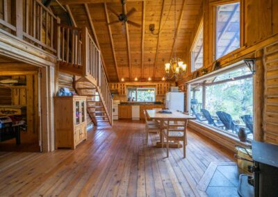 AP Ranch Interior Image of Cozy Canadian Cabin kitchen and dining area.