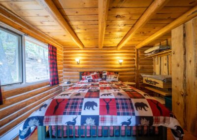 AP Ranch Interior Image of Cozy Canadian Cabin master bedroom.